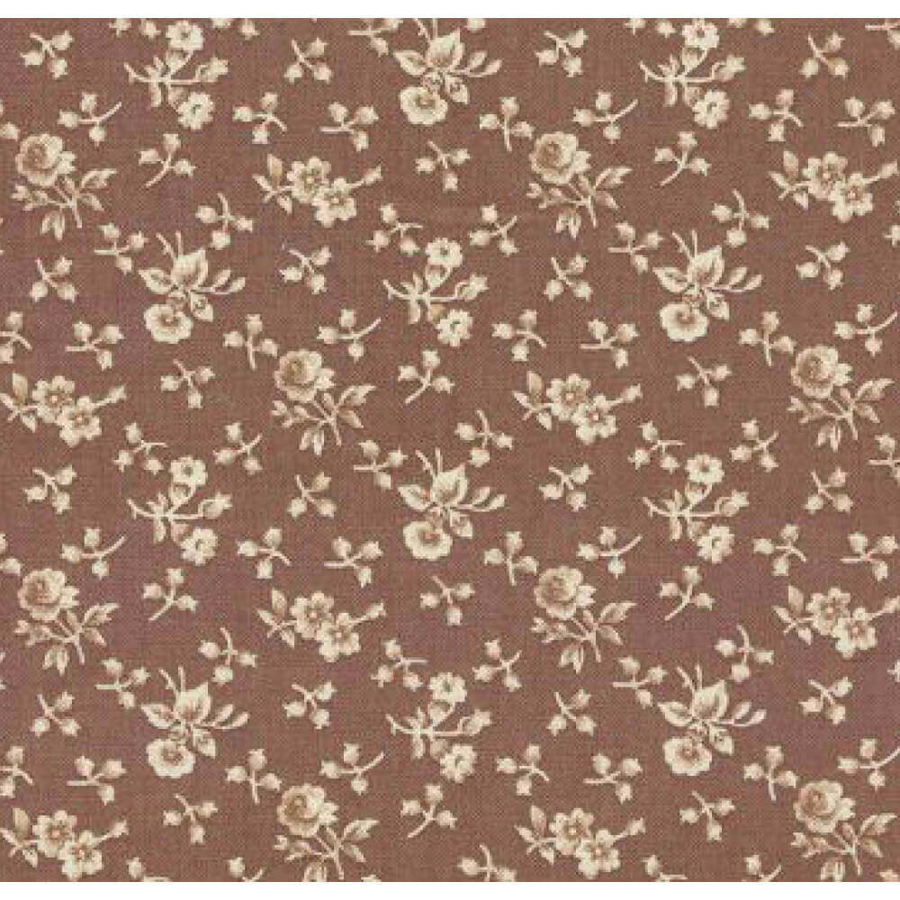 Brown calico fabric featuring delicate cream floral pattern, ideal for vintage-inspired clothing designs.