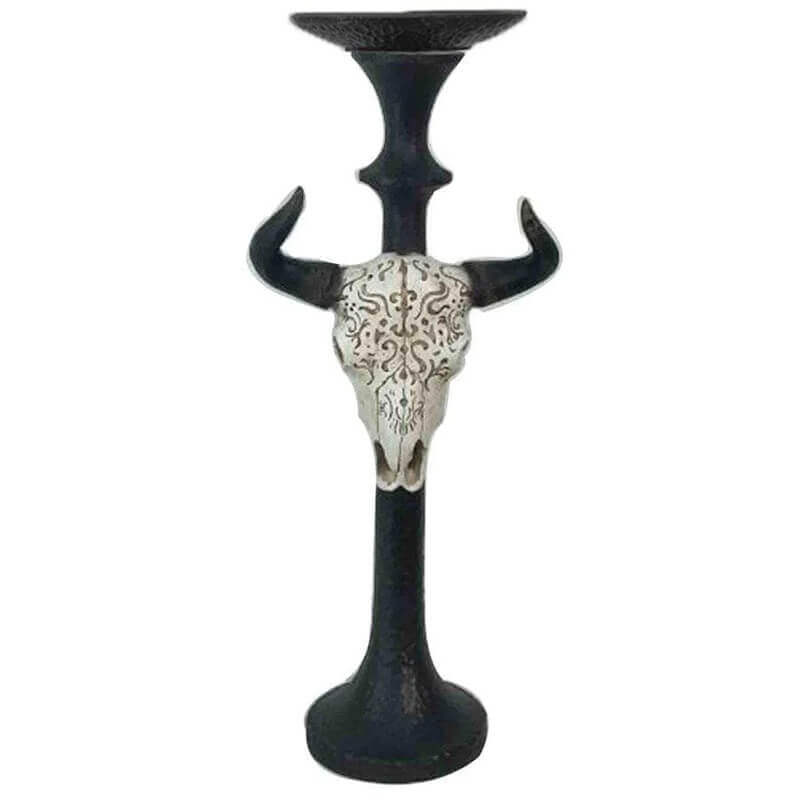 This Skull Taper Candle Holder will add a statement in any room. The skull features carved designs for added interest. Sold individually. Designed to hold up to a 3" pillar candle (candle not included).