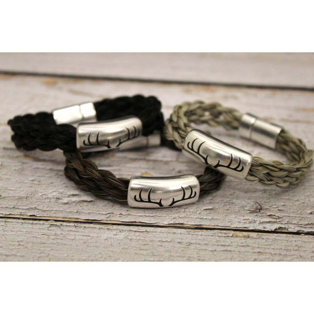 Capture the prized buck with this unisex Authentic Horse Hair bracelet. A zinc alloy antler slide compliments the seven strand horse hair braid finished with our sturdy magnetic clasp. Designed to be worn fitted vs loose.