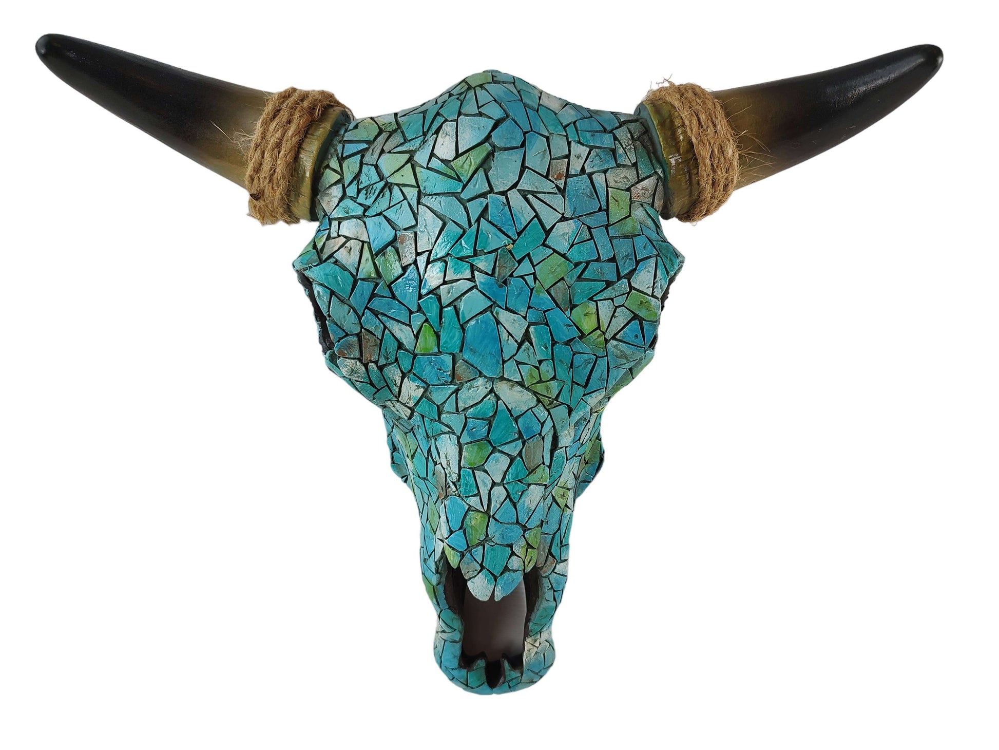 Decorative bull skull with turquoise mosaic pattern and brown rope around horns on a white background