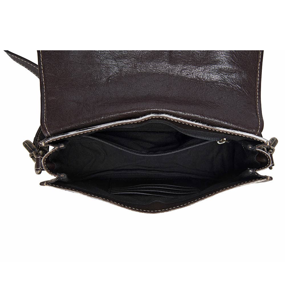 Black leather handbag with open interior on a white background