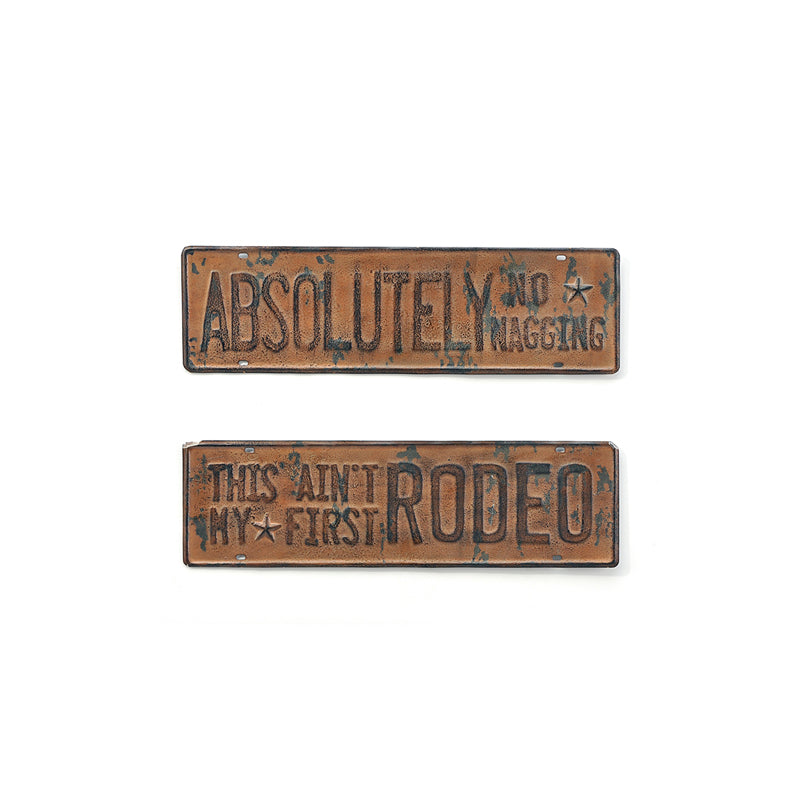 <p>Made to look used, weathered and worn this brown metal wall sign measures 14" x 4.3" Sign Sold Separately.</p> <p>"Absolutely No Nagging"</p> <p>"This Ain't My First Rodeo"</p>