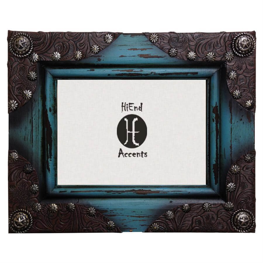 Turquoise painted and distressed wooden photo frame with tooled leather corners and silver Concho details adds a touch of western flair to your home. For photographs measuring 5" x 7". Can be utilized with either vertical or horizontal photographs. Back has swing tabs for easy installation, and a thick layer of glass protects your image. 