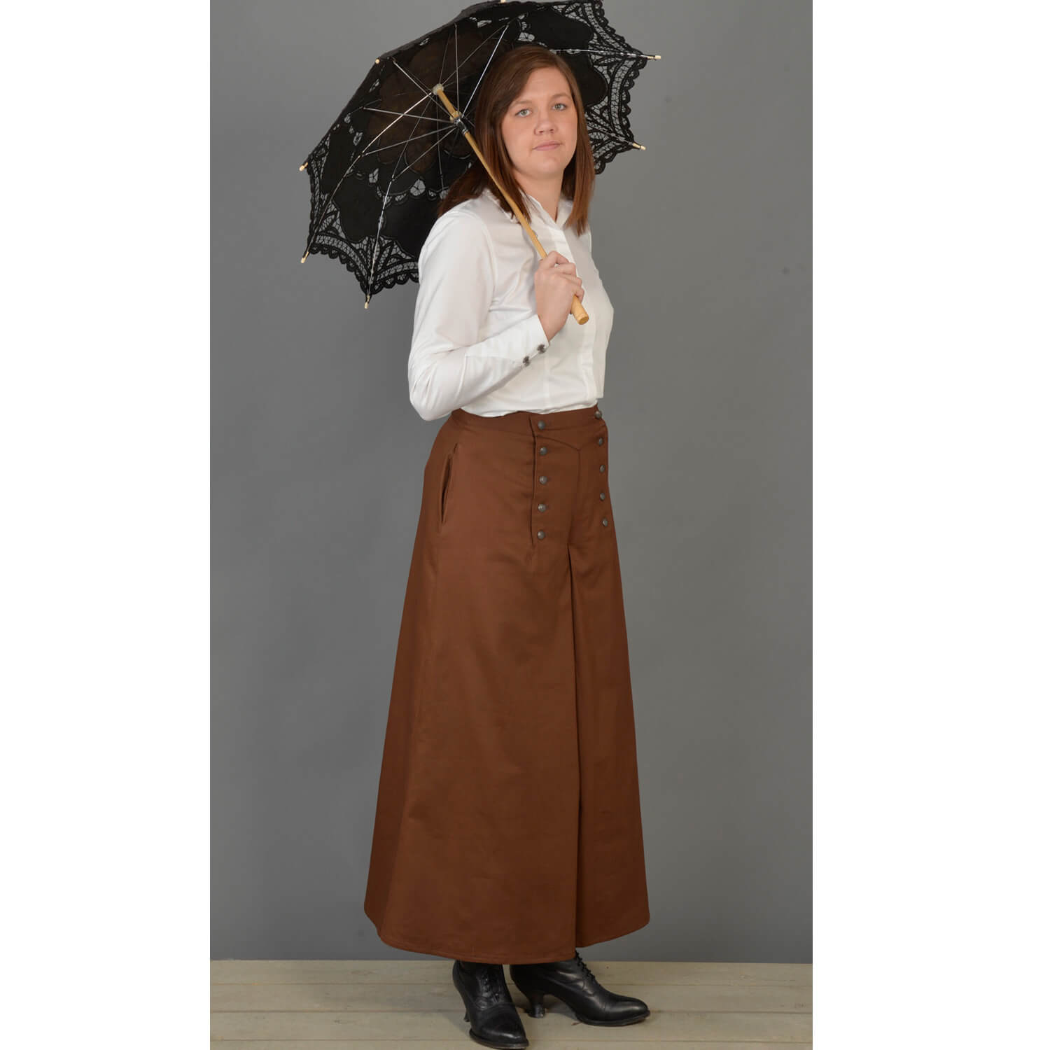 This split riding skirt design is our version of the popular riding skirt of the 1800’s. Cut with a slight flair, side pockets and front flap opening, this skirt allows ample movement for riding or walking. Victorian style buttons highlight the design and match the riding vest