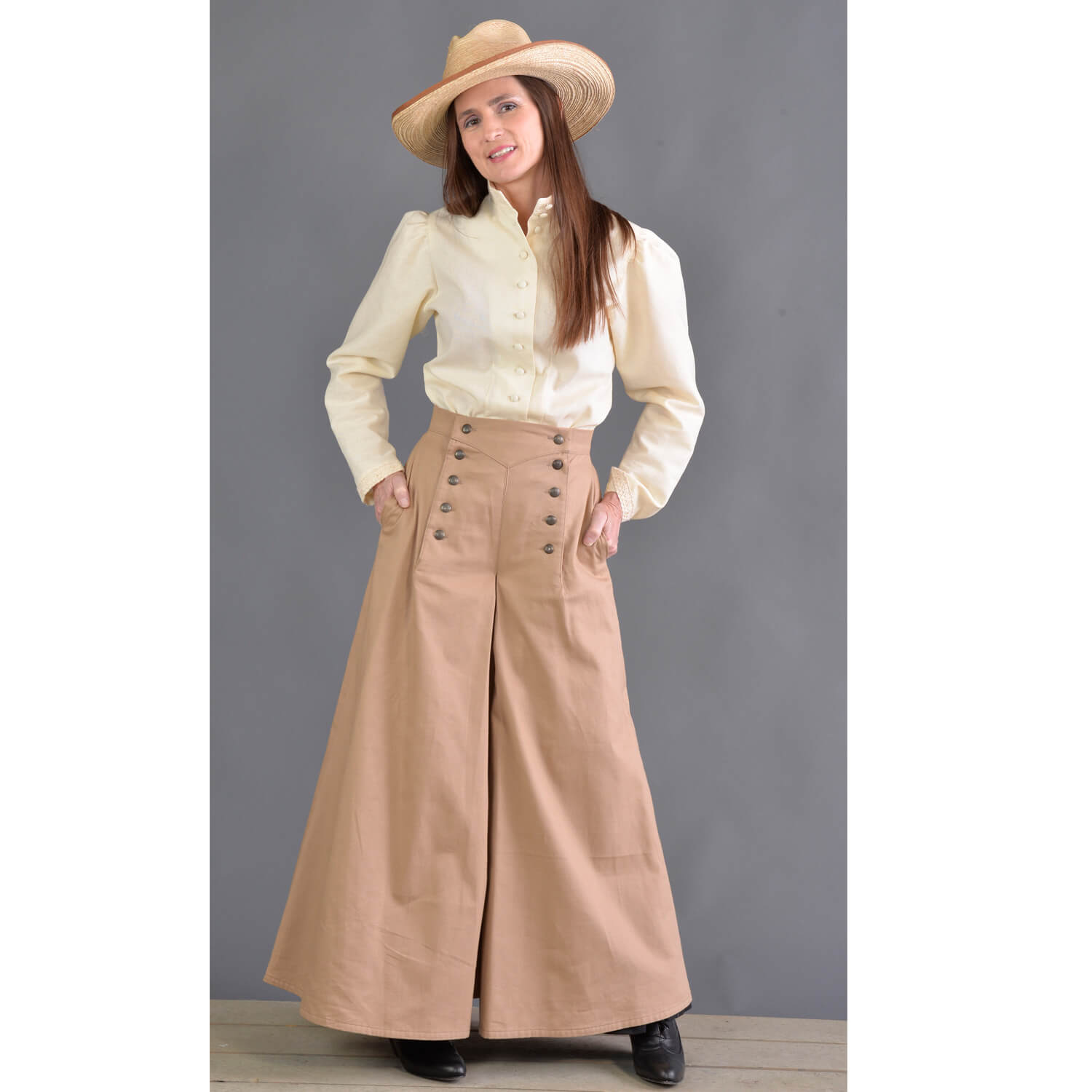 This split riding skirt design is our version of the popular riding skirt of the 1800’s. Cut with a slight flair, side pockets and front flap opening, this skirt allows ample movement for riding or walking. Victorian style buttons highlight the design and match the riding vest