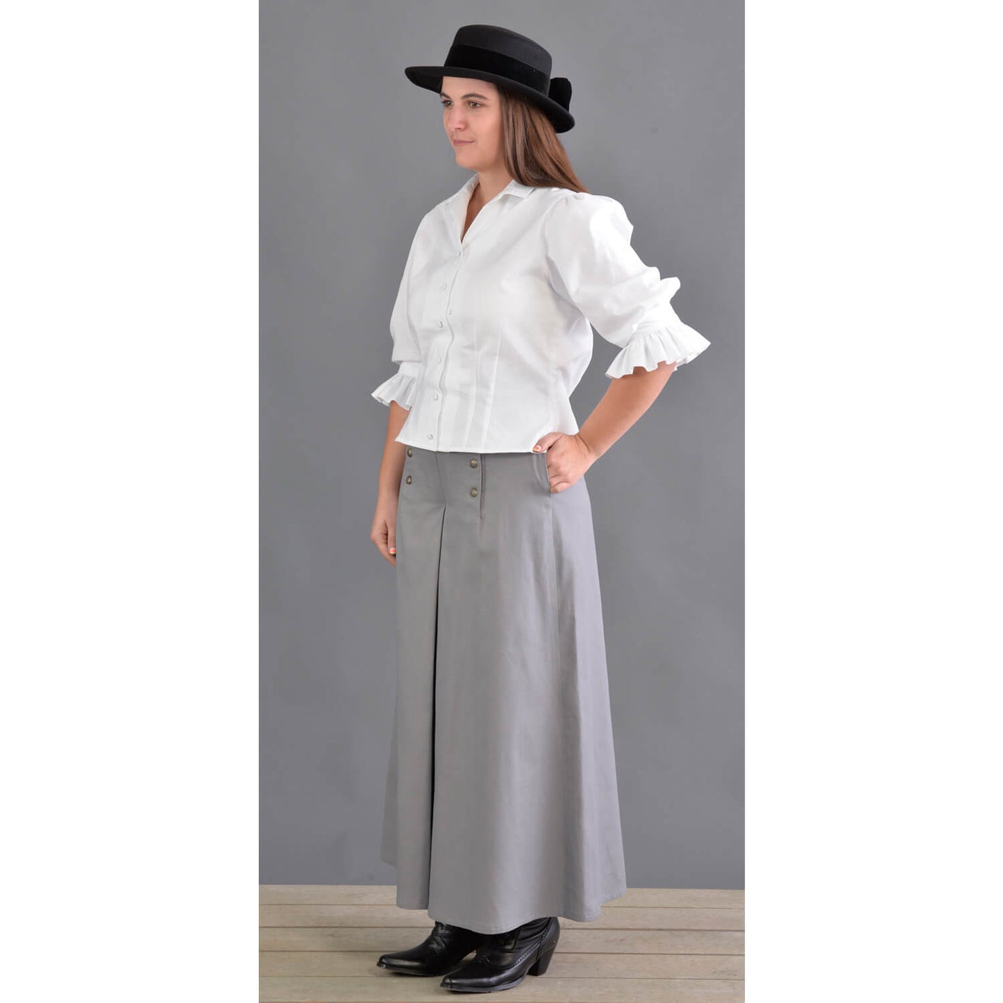 This split riding skirt design is our version of the popular riding skirt of the 1800’s. Cut with a slight flair, side pockets and front flap opening, this skirt allows ample movement for riding or walking. Victorian style buttons highlight the design and match the riding vest