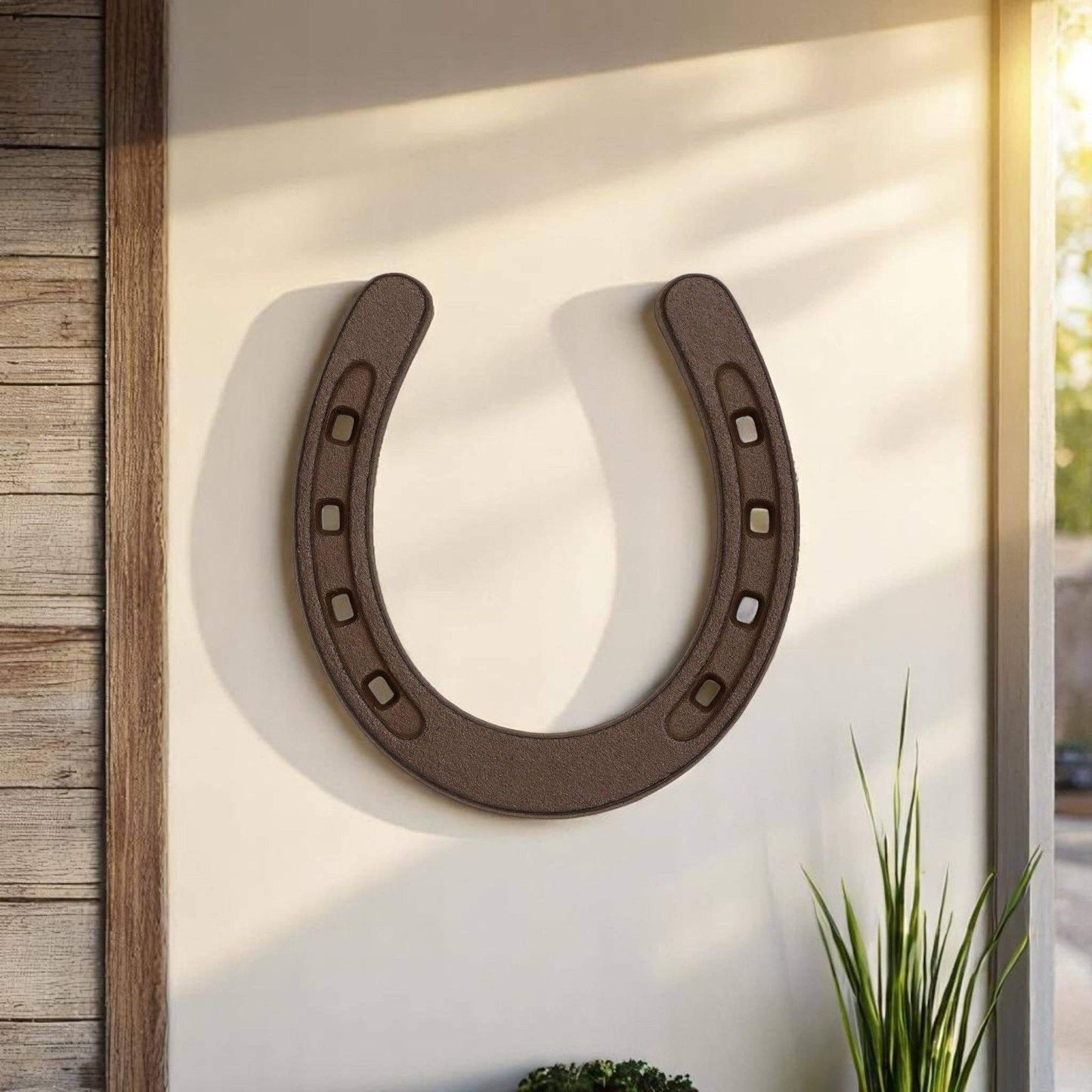 Rustic Western Cast Iron Horseshoe Home Decor Accent displayed on a wall, adding country charm and style.