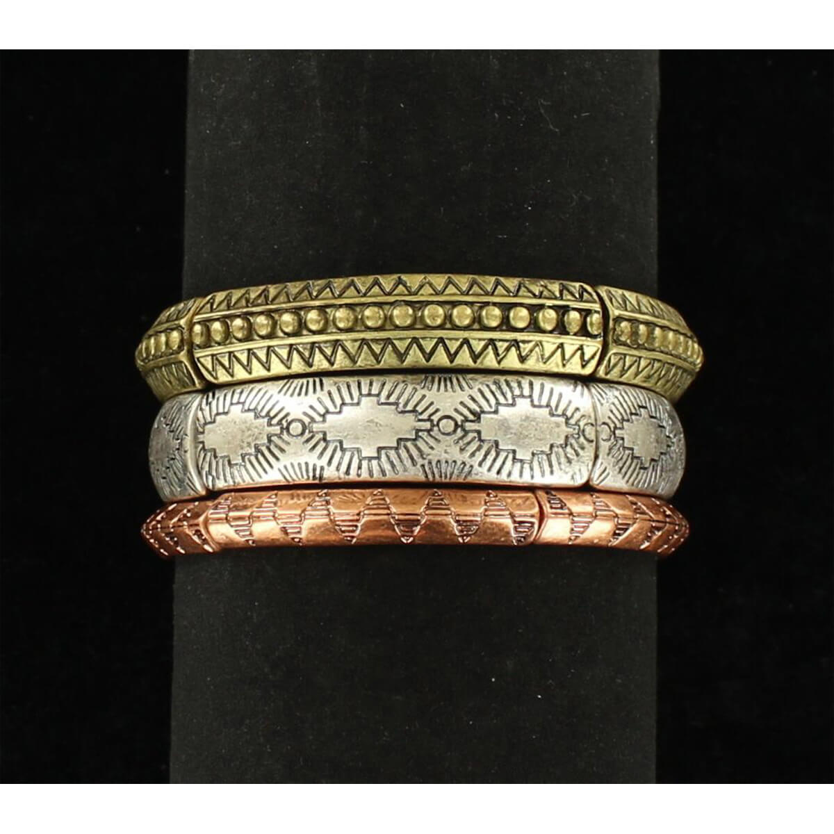 This 3-piece stretch bracelet features 3 tribal designs in silver, copper and antique gold.