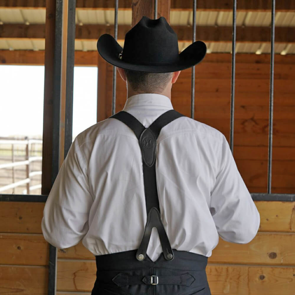 Grandfather probably wore a shirt like this with fine tailoring and pearl buttons. This shirt features a banded collar with a silver stud tack. It also comes with two attachable collars. You can add the tux collar for the fancier event or the rounded collar for a more traditional look. It’s like getting three shirts in one. Comes in fine pinpoint cotton. Made in USA.