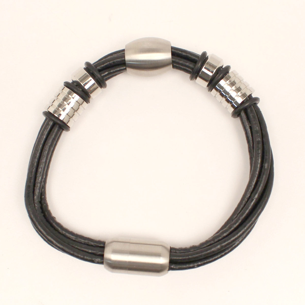 This men's western bracelet is very masculine. There are 5 genuine leather strands with metal ornaments. Magnet closure.