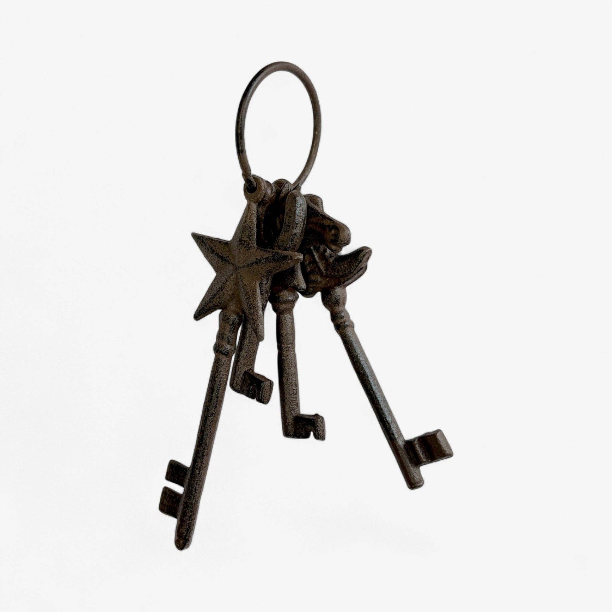 Set of four rustic keys on a white background