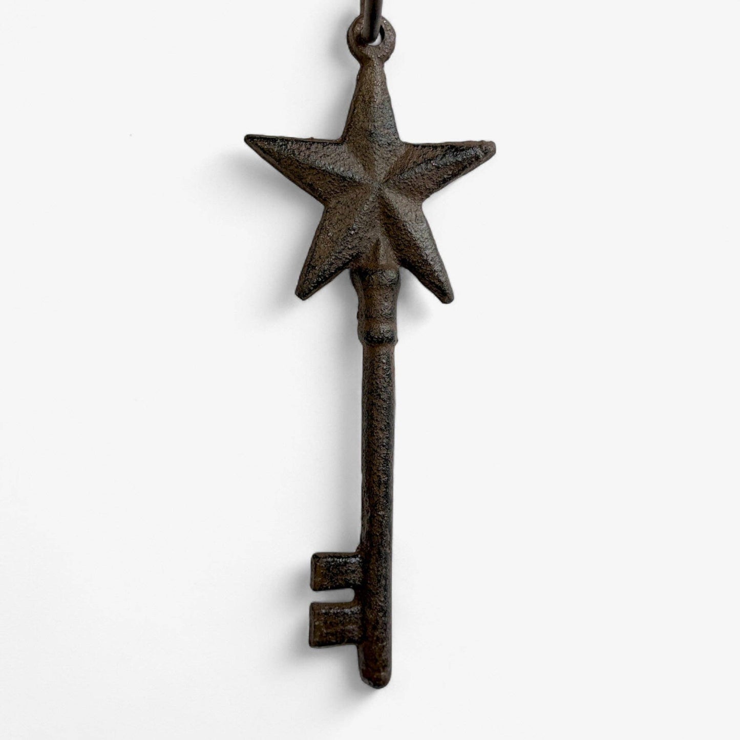 Decorative key with star design on a white background