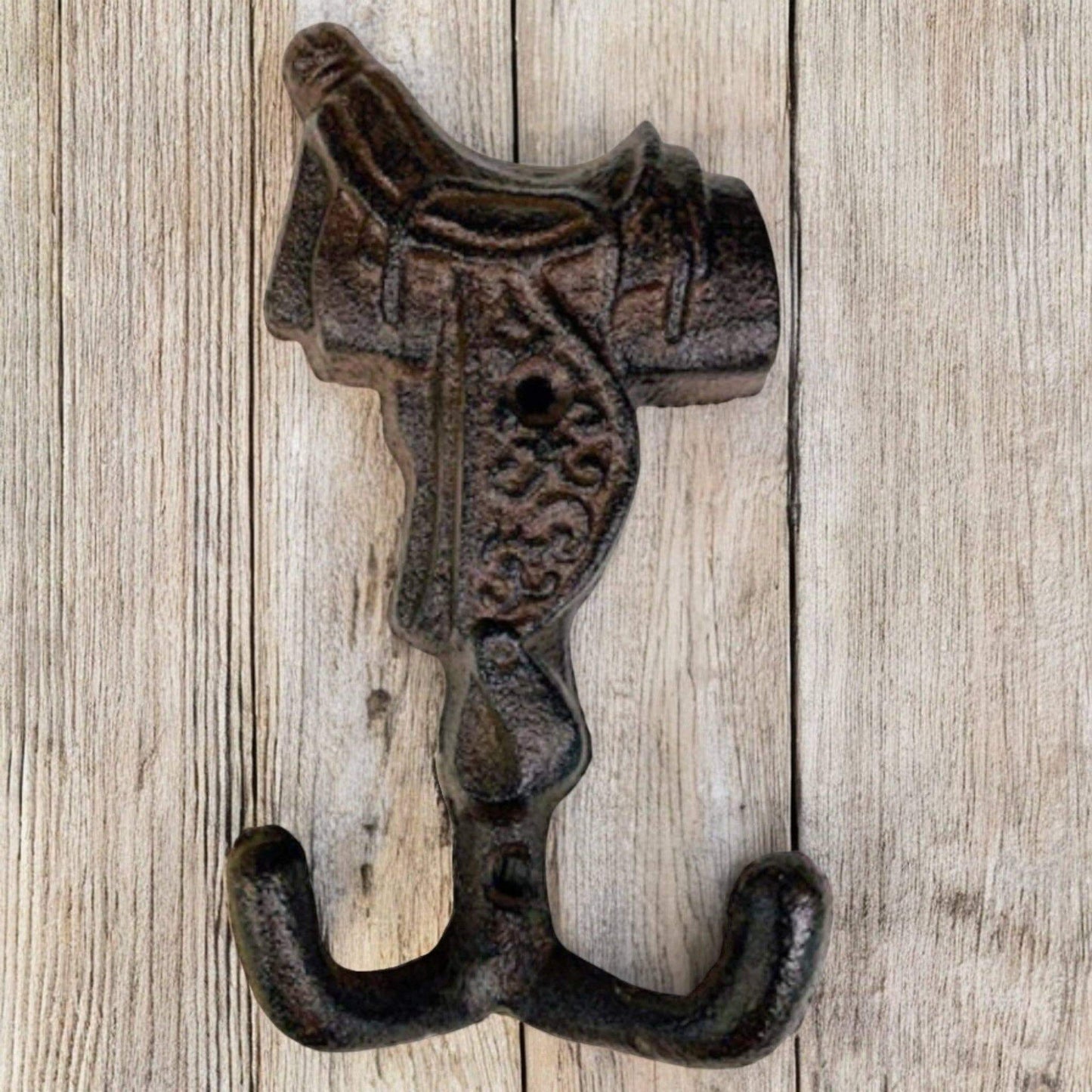 Old West Cast Iron Horse Saddle Hook designed for coats, scarves, or horse tack, featuring a rustic finish.