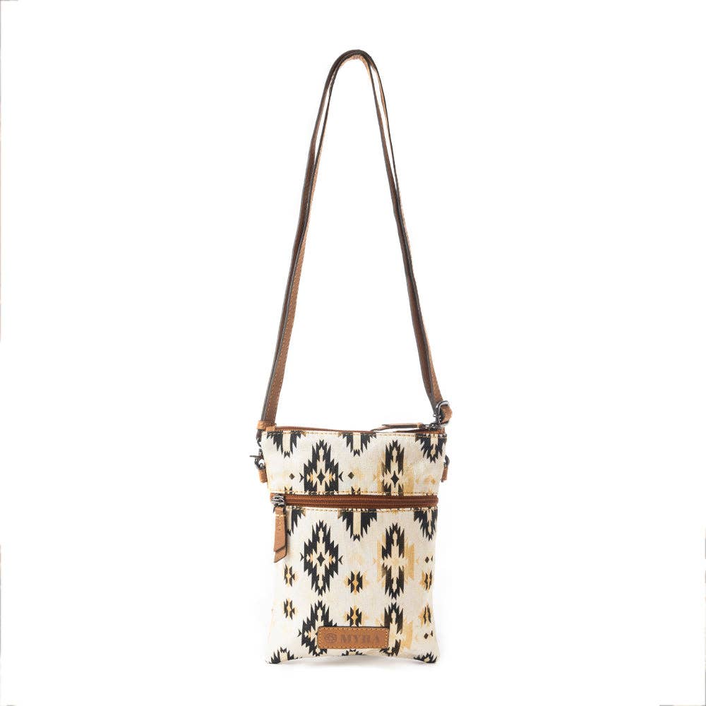 Crossbody bag with tribal pattern on a white background