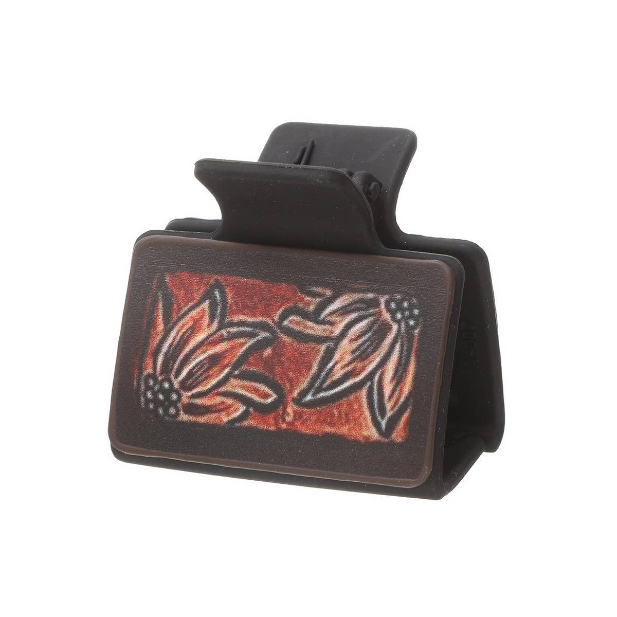 Black hair clip with floral design on a white background