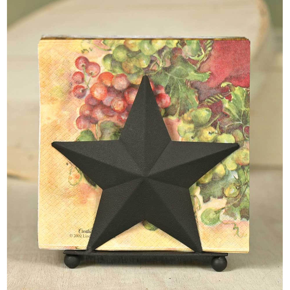 Bring western style to your kitchen with the Star Napkin Holder, featuring a simple star silhouette. 5¾"W x 2½"D x 6"T. Shown with standard 6½" square napkins, not included.