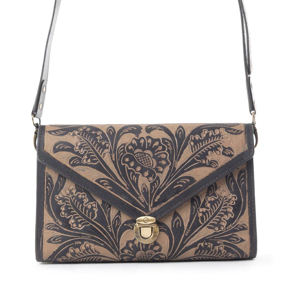 Floral patterned handbag with a gold clasp on a white background