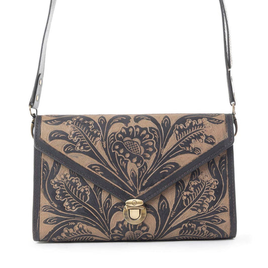 Floral patterned handbag with a gold clasp on a white background