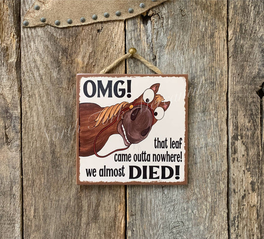 Wooden sign with cartoon horse and humorous text on a wooden background