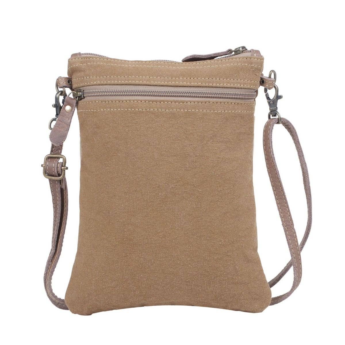 Brown crossbody bag with a strap on a white background
