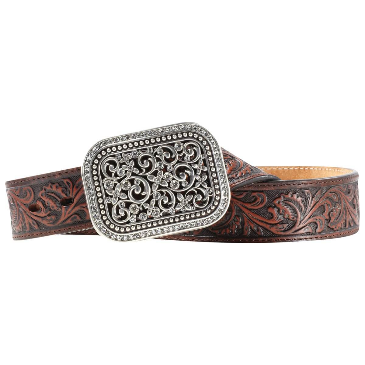 Wear the Wild West. Intricately tooled leather and a bold rhinestone studded filigree-cut removable buckle create its handcrafted look. Silver filigree buckle with crystals.