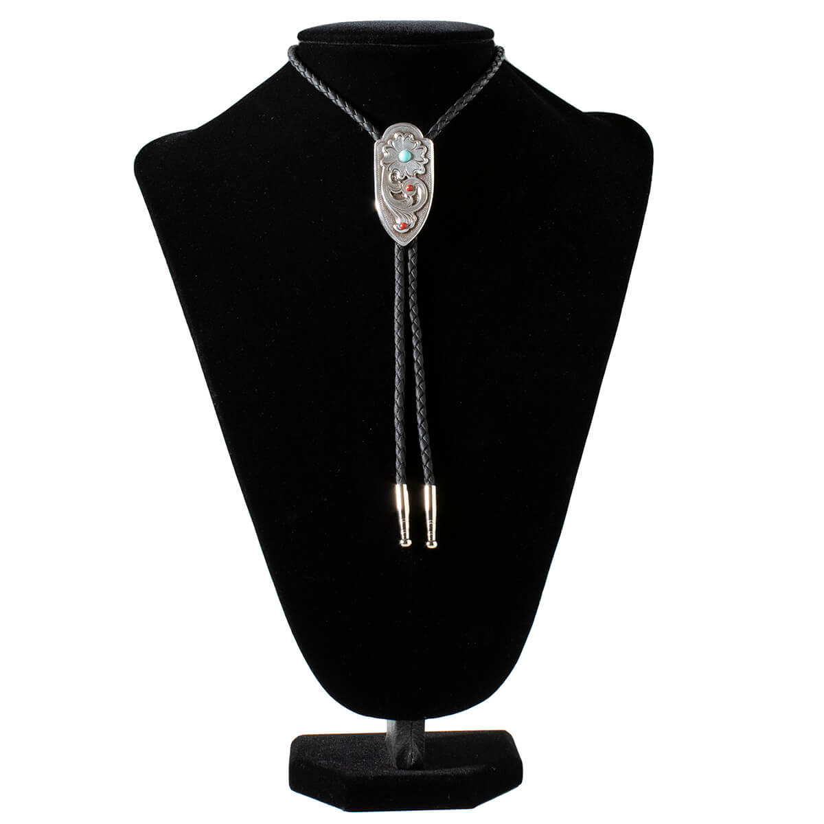 This eye-catching bolo tie blends rustic charm and modern style, making it a versatile accessory that elevates any look. The intricate floral details and vibrant stones create a standout design that commands attention, while the adjustable length and braided cord ensure a comfortable, customized fit. Measures 2" long by 1" wide.