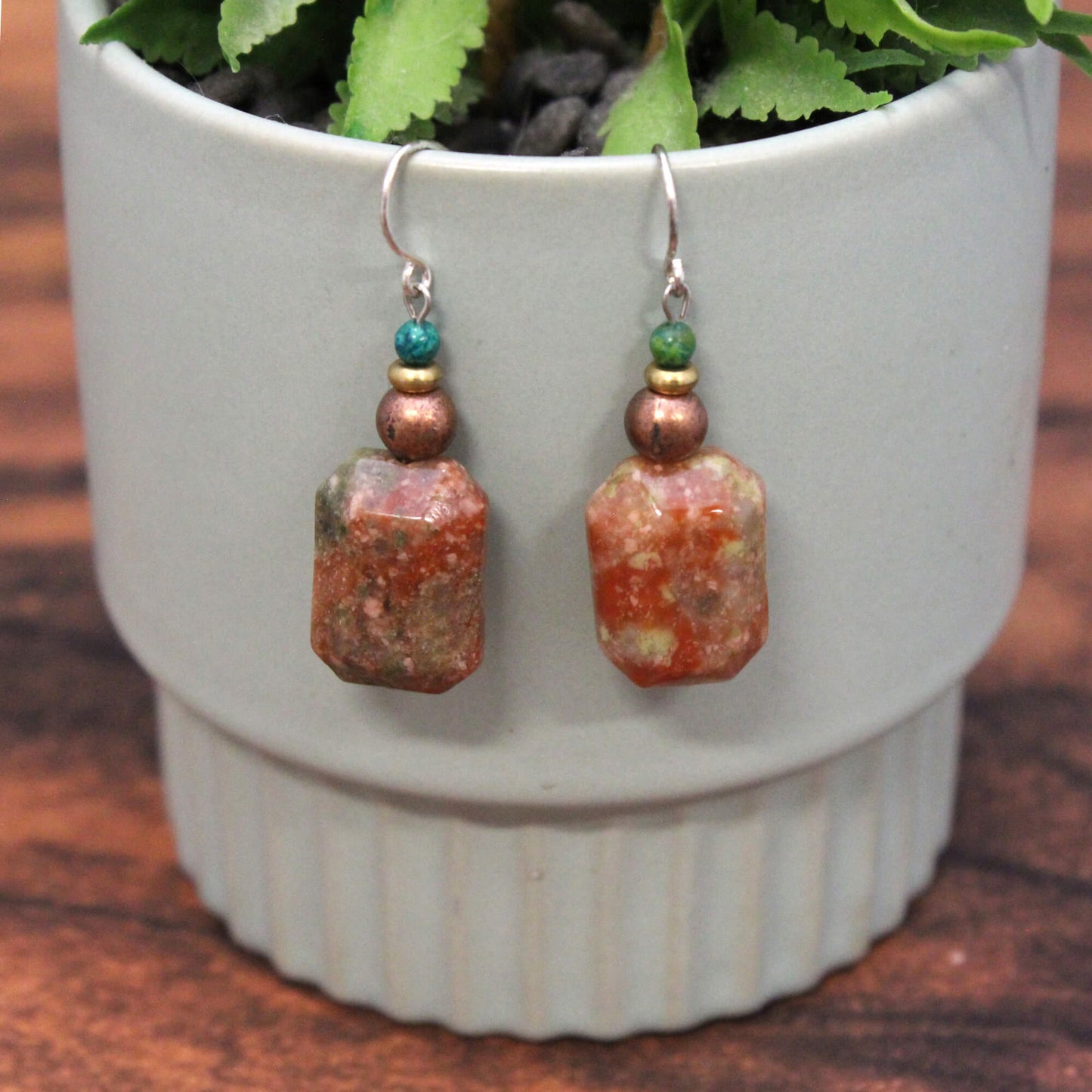 Autumn Jasper stone helps to ground and center during times of stress. This stone encourages a strong connection to the earth. Measures approx. .5″ across and 1.25″ from the base of hypo-allergenic ear wires.