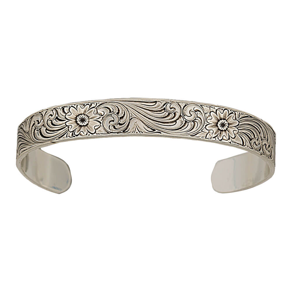 This fully engraved, slim cuff bracelet reflects the simplistic and natural qualities of a western lifestyle. Delicate and beautiful, the antiqued silver finish highlights the engraved artistry for a fashion that transitions easily from casual to evening wear. Perfect for layering with other bracelets.