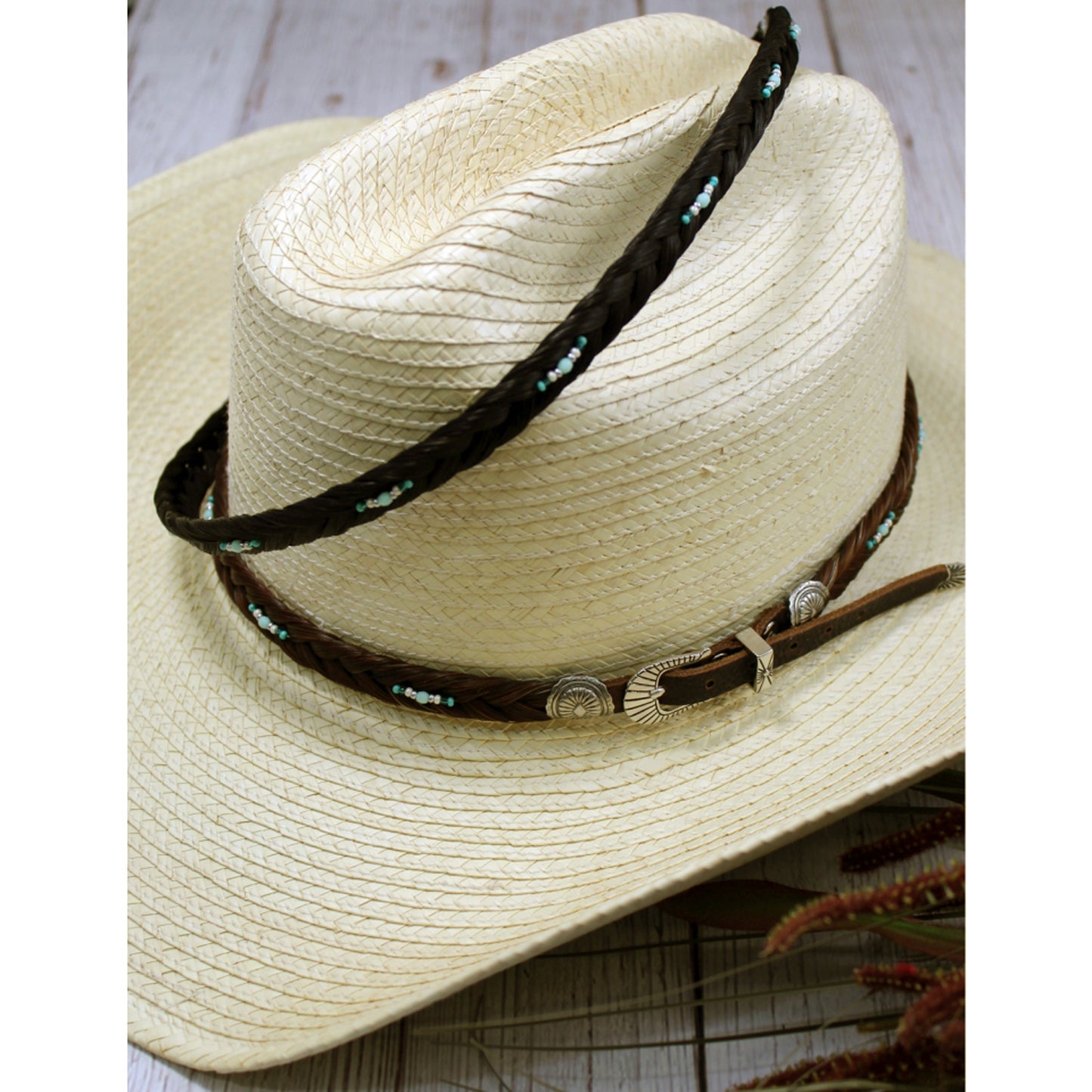 A classic. Colorful seed bead accent an authentic horse hair plait that adjusts to any hat by a leather belt and buckle closure. Bead color may vary. 3/8 inches wide.