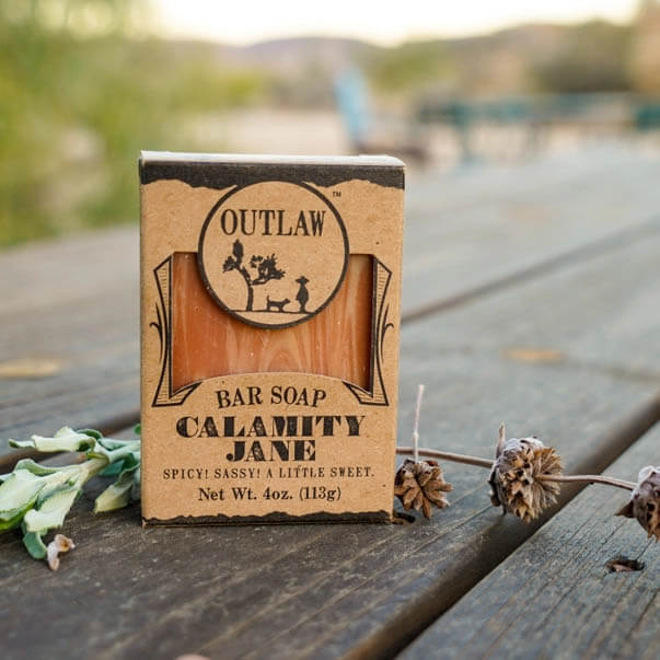 Calamity Jane smells like clove, orange, cinnamon, and a kick of whiskey (of course!). It's quickly growing in popularity as one of our most beloved scents, and no question why: It's great for both men and women, it's sweet with a kick.