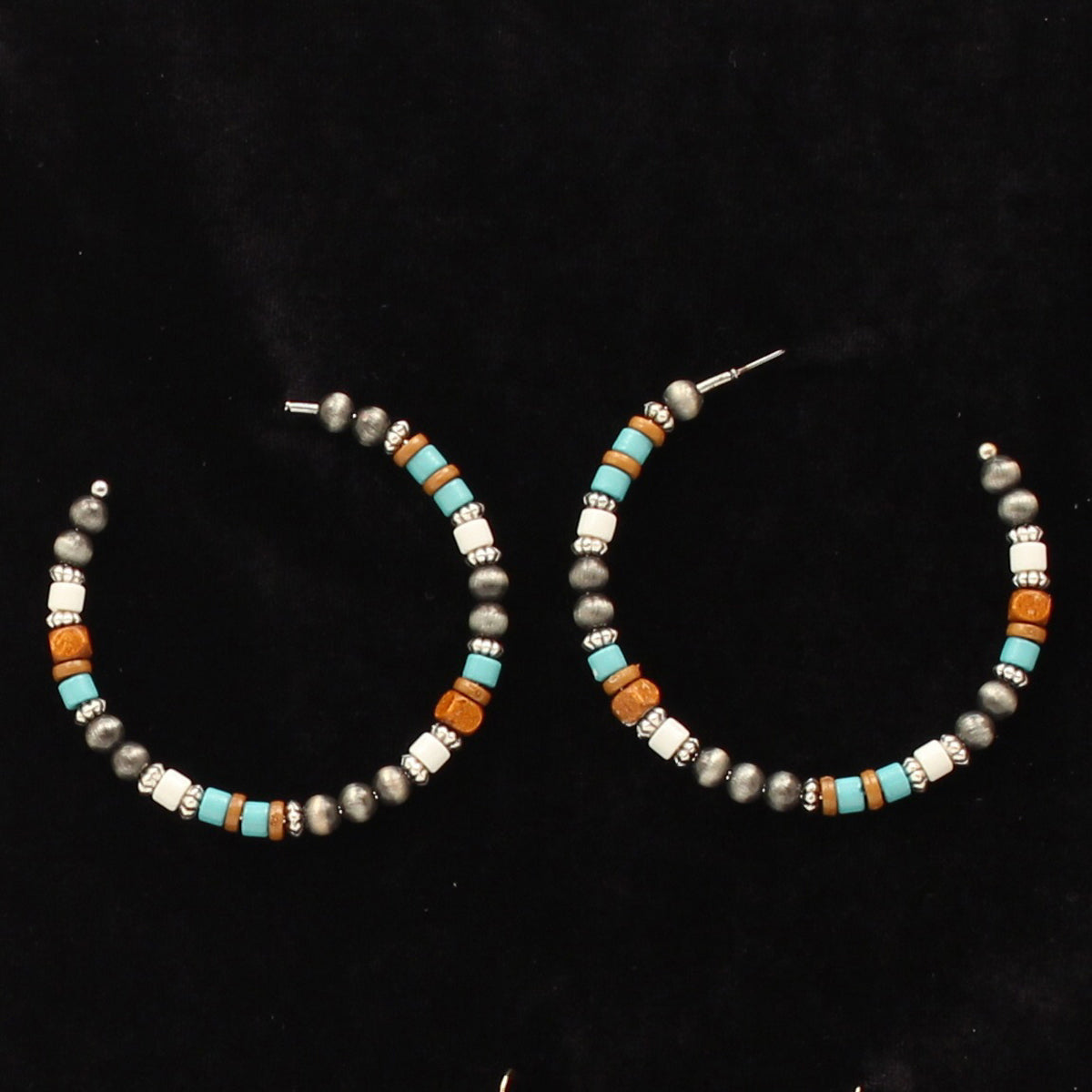 Try these trendy hoop beaded earrings! Cute cowgirl hoop earrings in different size beads with colors that will compliment most outfits. Imported