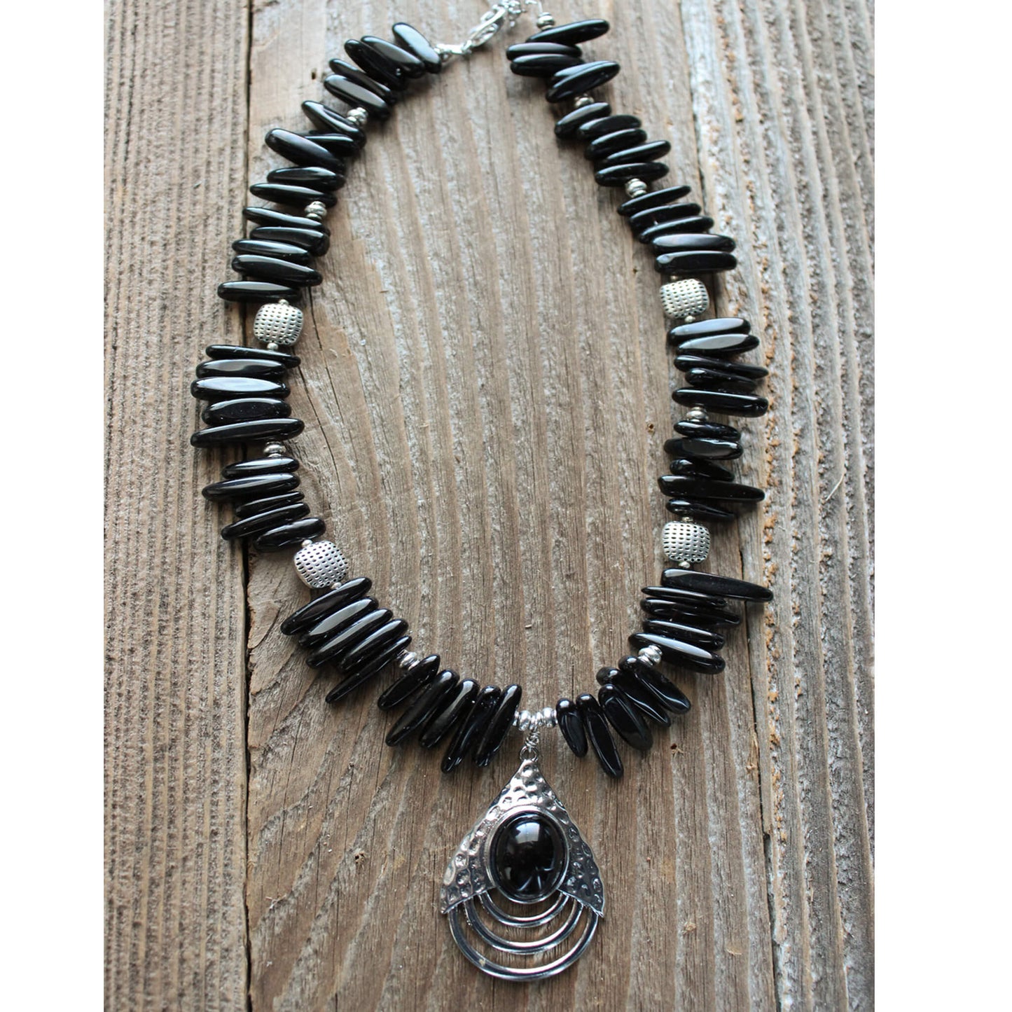 The semi-precious Black Onyx repels stress and negativity. This black beauty measures 16-20″ and is a good addition to any western wardrobe.