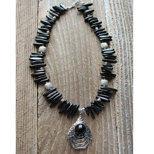 The semi-precious Black Onyx repels stress and negativity. This black beauty measures 16-20″ and is a good addition to any western wardrobe.