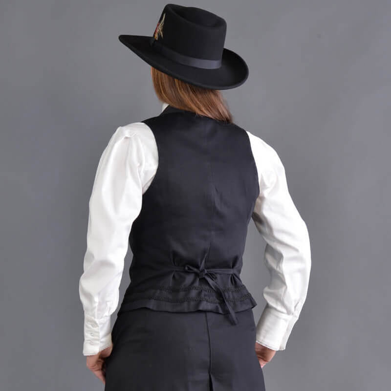 Our summer version to our riding jacket is this new Riding Vest. Stay cool in the summer heat or wear it with a blouse to stay warm and look great either way! Available in six great colors with black contrasting lapels and two rows of rayon black braid along the bottom. Silver engraved Victorian style buttons accent this vest and match our 1800’s riding skirt. Wear it with our matching riding skirts or with your favorite pair of jeans. Made of 100% cotton twill and lined in polyester.