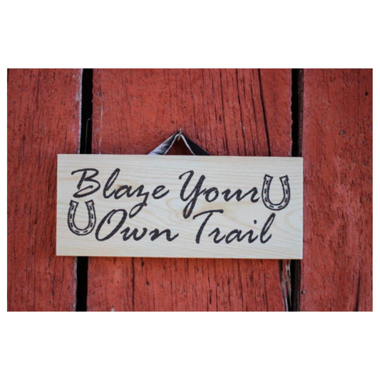 This sign is more than just wall décor - it's a daily reminder to forge your own trail and not be afraid to go against the grain. Hang it in your home, office, or cabin as a source of inspiration and motivation to live life on your own terms. Made by skilled artisans, each sign is a true original that will add warmth and character to any space. Measures 13" x 5 1/2" x 3/4". Made of Pine.