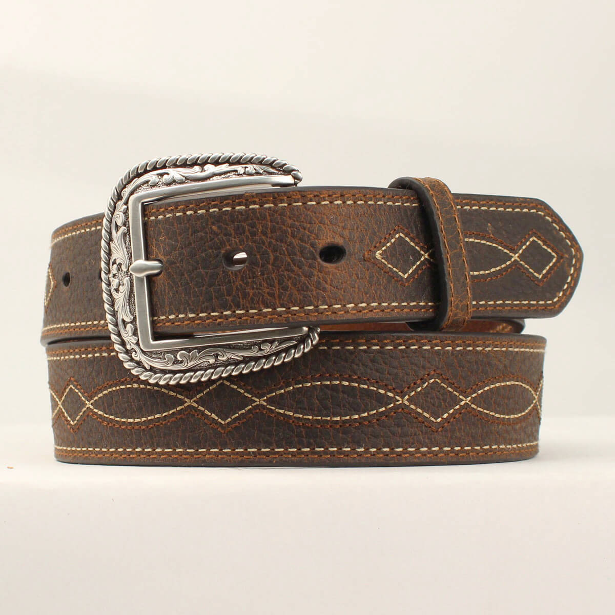 This men's&nbsp;Ariat belt has a rugged look, but is practical for every day wear. The brown strap has a tan boot stitch design down the center, and is complete with a silver etched buckle. This quality belt looks great and is designed for any occasion. Measures 1-1/2" wide. Removable Buckle. Imported.