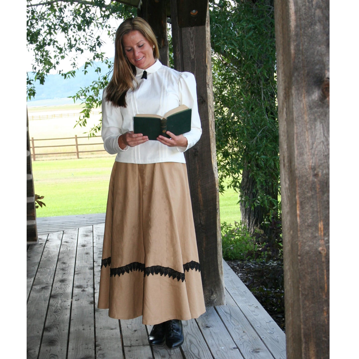 Nothing could be more appropriate for a stroll down the boardwalk to the general store than our Braided Gore Skirt. It is made of a soft linen/rayon blend fabric with a touch of old-fashioned black braid scalloped along the eight gores. Skirt includes side pockets, back elastic waistband for a comfortable fit. Add one of our blouses and a petticoat for old time perfection. Approximately 35" long. Made in USA.