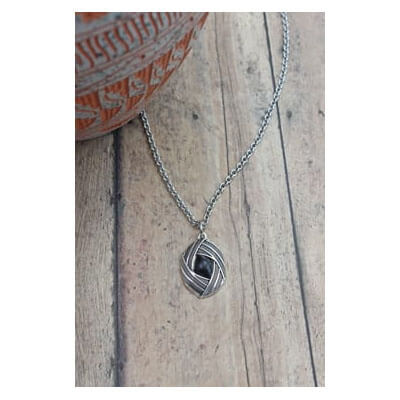 Unique onyx and antique silver-plated pendant .75″ by 1″ on a stainless-steel chain measuring 20″ including a 4″ extender and lobster claw clasp. This gem inspires feelings of personal power that comes from facing your fears. Each piece is unique and may vary slightly.