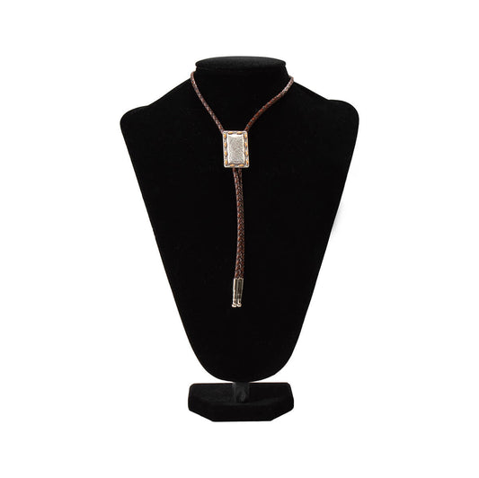 Bolo Tie on a black mannequin bust with a white background
