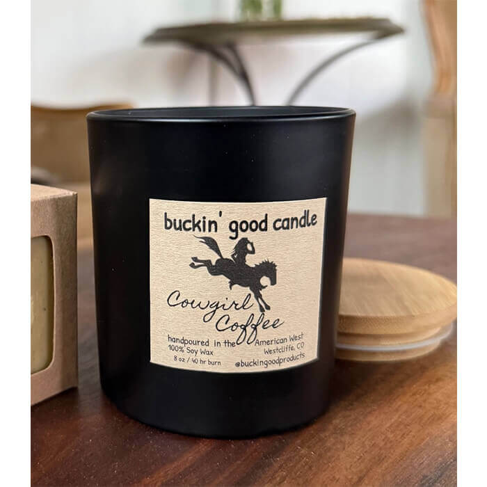 Buckin' Good Candle in matte black ceramic vessel with bamboo lid, featuring cowgirl coffee scent.