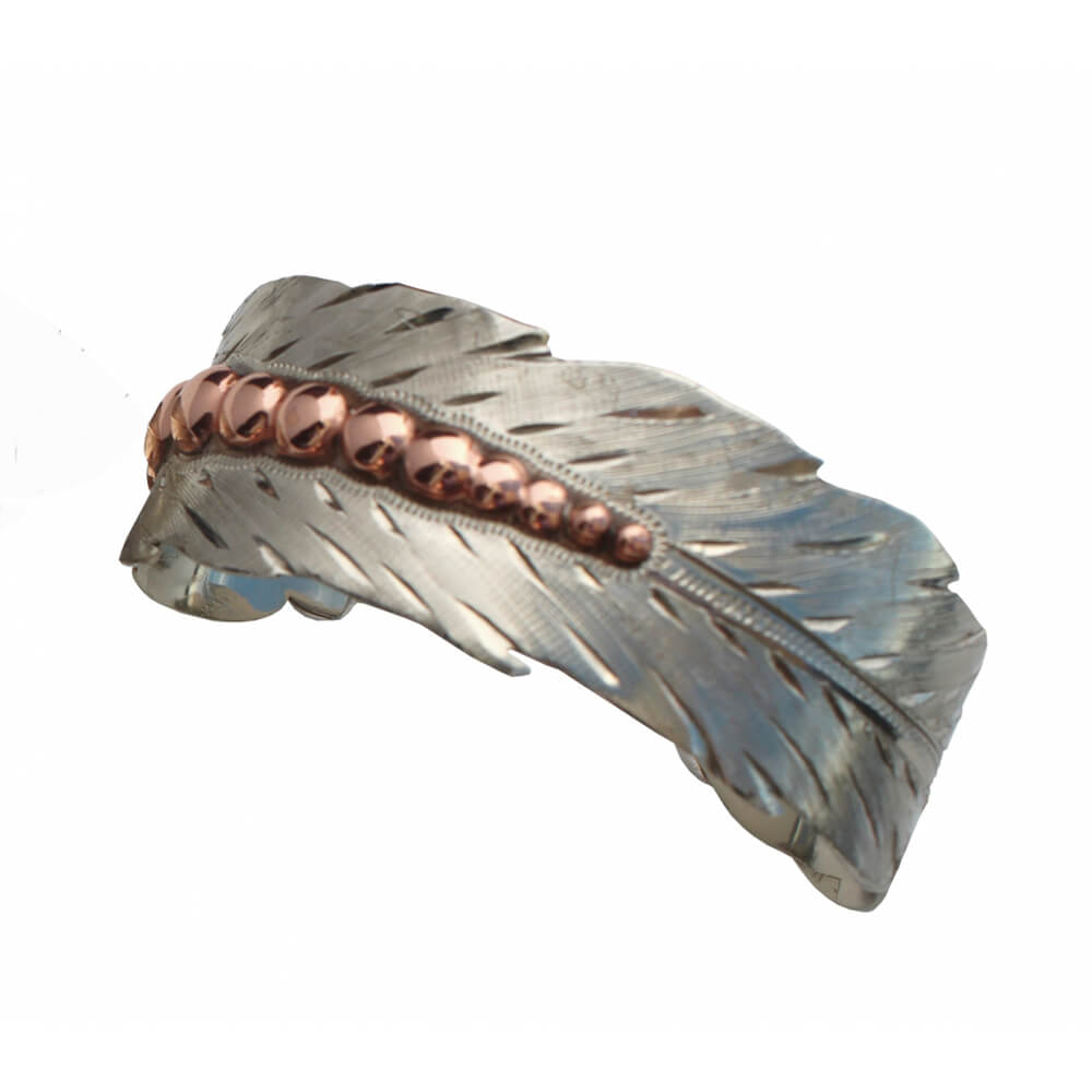 You’ll feel fabulous wearing this feather jewelry! Each piece has a bright silver with a copper finish accent along the shaft that captures and reflects the light with every turn. Made of sterling plated German silver and copper. 1" Wide