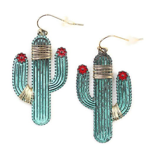 Show off your playful style with the Patina Cactus Earrings. The patina copper cactus design is eye-catching and the brass wire detailing gives these earrings beautiful depth and texture. The red flower accents add a pop of color that makes these earrings so fun to wear. You'll love how these statement earrings instantly elevate any outfit. Measures 1" by 1-3/4"