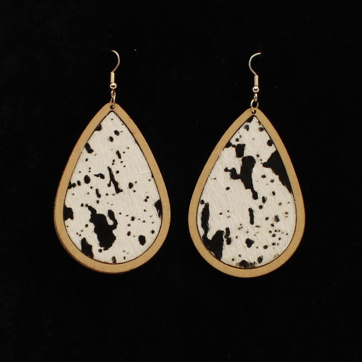 These Cute cowhide dangles earrings have hip country style. Wooden tear drop style with calf hair inlay. French hook style. Imported