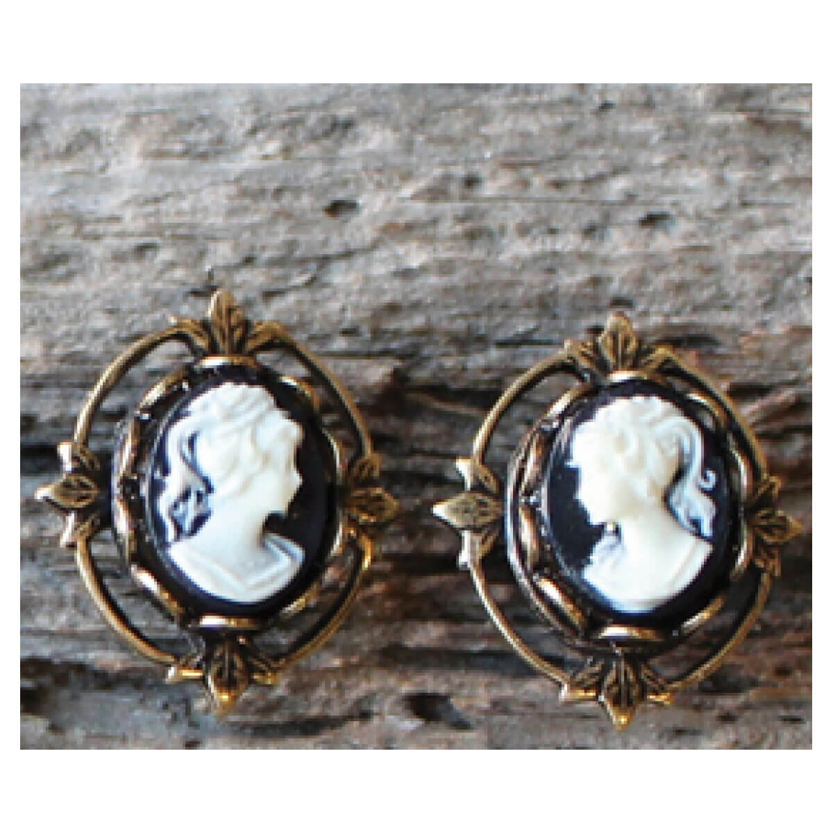 Our antique reproduction vintage style cameo jewelry gives you a real heirloom look and feel at a great price! These faux cameo earrings are set in an antiqued natural brass flower frame. The earring posts are surgical steel/hypo-allergenic. (These earrings do not drop and hug the ear lobe.) Made in USA. Measure 1/2" wide by 3/4" long.