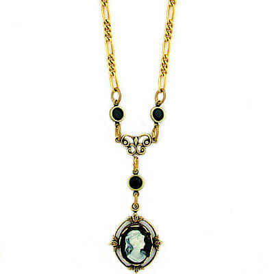 Our antique reproduction vintage style cameo jewelry gives you a real heirloom look and feel at a great price! The faux cameo is set in an antiqued natural brass flower frame. The antique gold plated Figaro link necklace chain measures 16”. The connectors are antiqued natural brass with Swarovski Austrian crystals. Earrings Sold Separately. Made in USA.