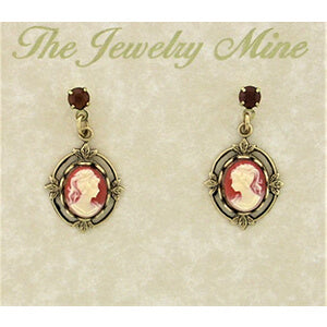 Pair of cameo earrings on a 'The Jewelry Mine' branded card.