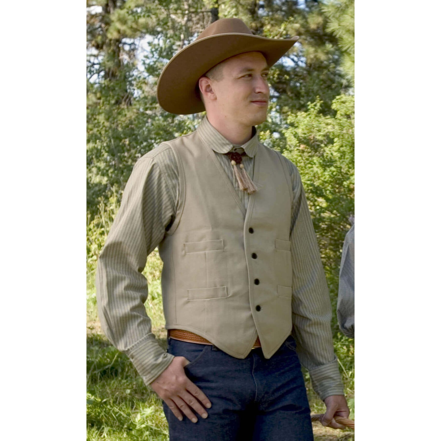 Our sturdy canvas Duck Vest is perfect for fence mending, day riding or just looking good. Made of 100% canvas duck, it comes unlined with four welt pockets. Wear this vest with one of our wild rags for the perfect trail riding outfit. Adjustable back vest buckle Dry clean only. Made in USA.