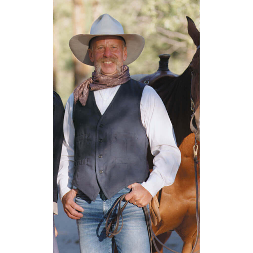 Our sturdy canvas Duck Vest is perfect for fence mending, day riding or just looking good. Made of 100% canvas duck, it comes unlined with four welt pockets. Wear this vest with one of our wild rags for the perfect trail riding outfit. Adjustable back vest buckle Dry clean only. Made in USA.