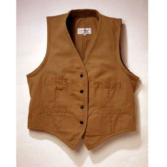 Our sturdy canvas Duck Vest is perfect for fence mending, day riding or just looking good. Made of 100% canvas duck, it comes unlined with four welt pockets. Wear this vest with one of our wild rags for the perfect trail riding outfit. Adjustable back vest buckle Dry clean only. Made in USA.