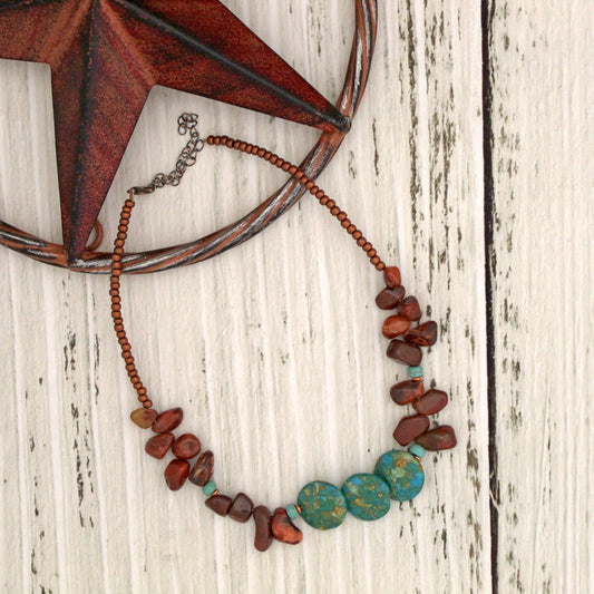 This eye-catching necklace makes any outfit instantly more glamorous. The organic shapes and neutral tones of the Carnelian and Magnesite stones add natural beauty to your look. 16-18" long.